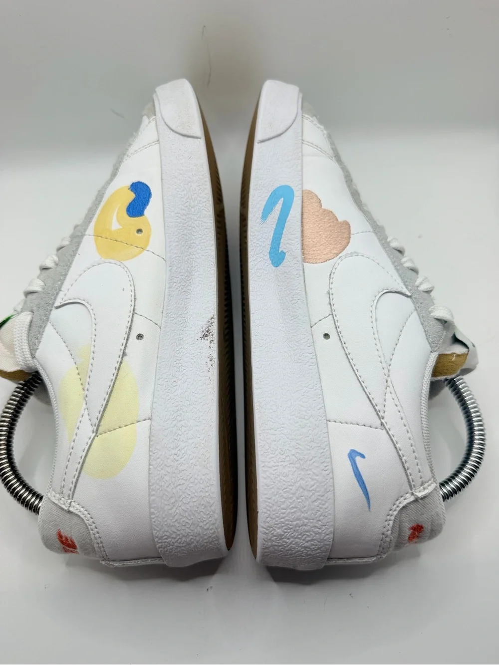 Nike White Low-Top Sneakers with Blue, Green, Yellow and Orange Accents